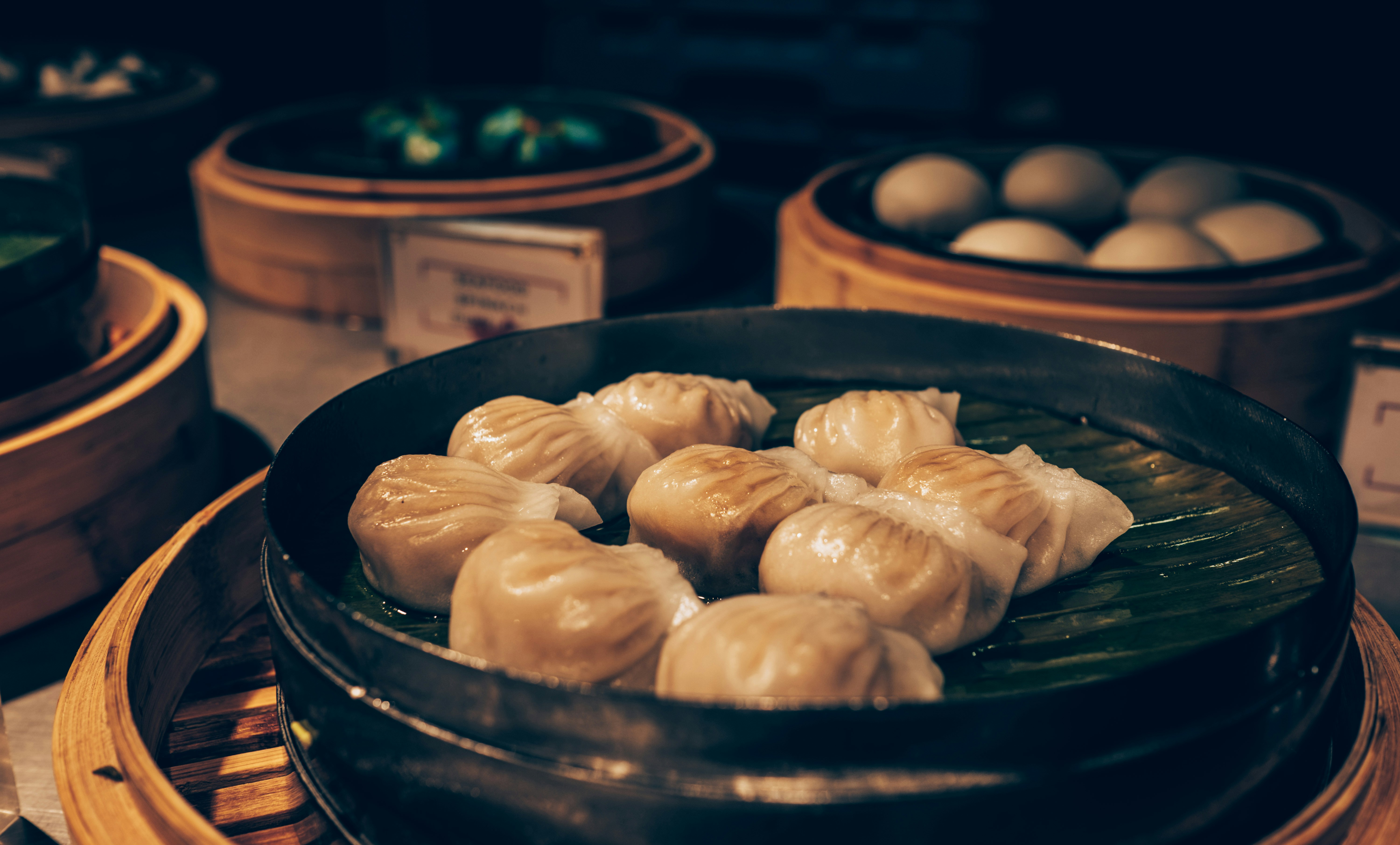 Bamboo steamer baskets with dim sum dumplings
